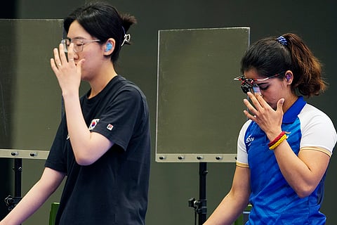 South Korea's Yang Jiin, left, and India's Manu Bhaker
